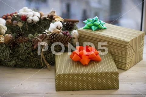 Colorful Gift Boxes Wrapped In Paper And Christmas Wreath