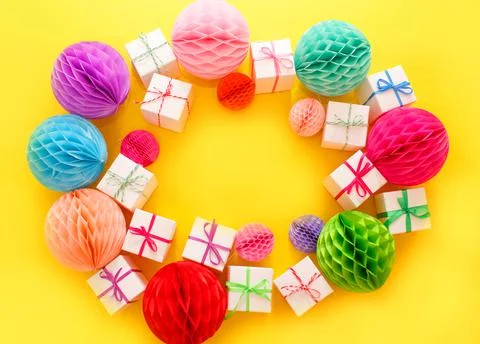 Colorful gift boxes on a yellow background top view. Stock Photos