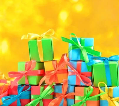 Colorful gifts on a bokeh background Stock Photos