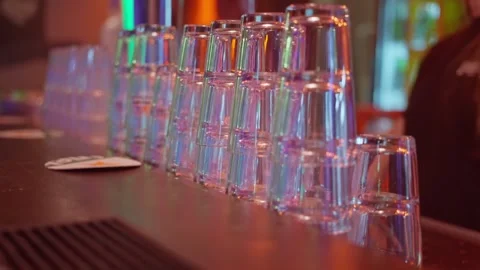 A Colorful Glass Stack at a Bar A Captivating Nightlife Scene Full of Energy and Stock Footage 310466197
