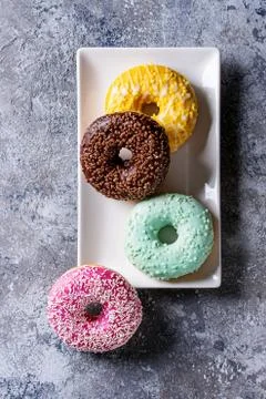 Colorful glazed donuts Stock Photos