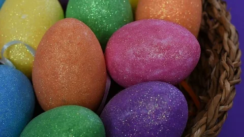 Colorful glittering Easter eggs in wicker basket Stock Footage 105472796