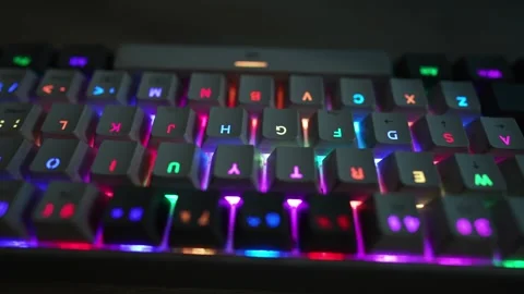 Colorful glowing computer mechanical keyboard slow motion viewing footage Stock Footage 290950184