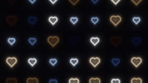 Colorful glowing hearts pattern on dark background for Video stock 338041990