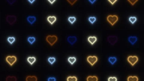 Colorful glowing hearts in a pattern on a dark background Stock Footage 338192439