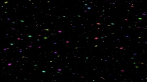 Colorful glowing light particles falling against black background Video stock 347088152