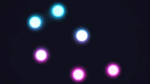 Colorful glowing lights move in abstract patterns on dark Stock Footage 338041965