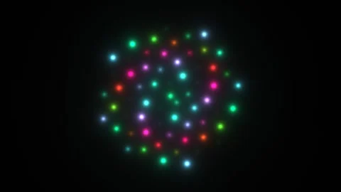 Colorful glowing particles create movement in a dark Stock Footage 338225913