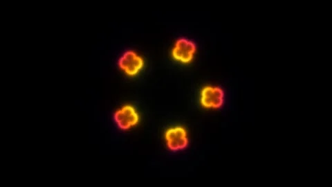 Colorful glowing shapes create a visual pattern on a dark Stock Footage 338041412