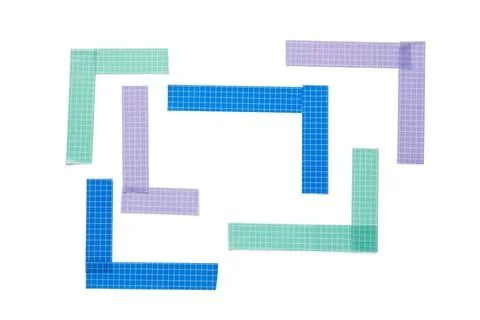 Colorful grid pattern washi tape pieces forming a frame on a clean white back Stock Photos