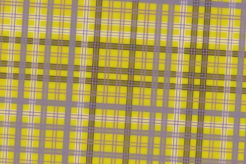 Colorful grid pattern with yellow, pink, and purple squares Stock Photos