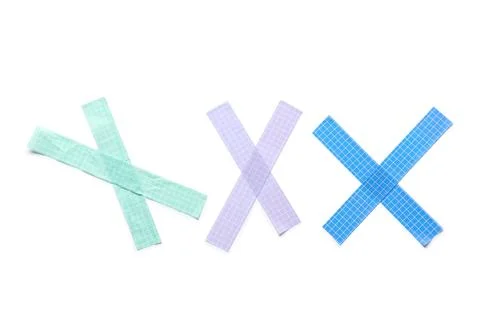 Colorful grid patterned washi tape crosses isolated on white background for c Stock Photos