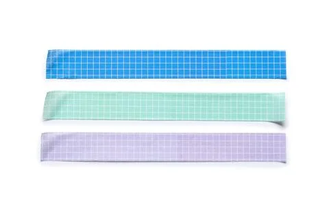Colorful grid patterned washi tape strips for crafting and decoration, isolat Stock Photos