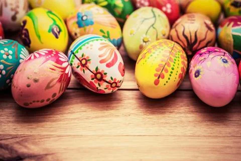 Colorful hand painted Easter eggs on wood. Unique handmade, vintage design. Foto stock
