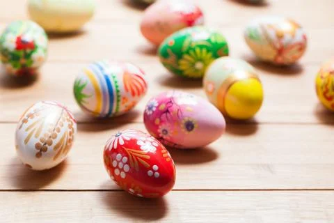 Colorful hand painted Easter eggs on wood. Unique handmade, vintage design. 스톡 사진