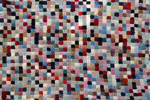 Colorful handcrafted patchwork quilt Stock Photos