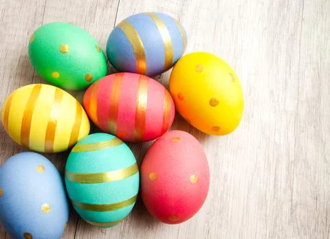 Colorful handmade painted easter eggs on a wood background Stock Photos
