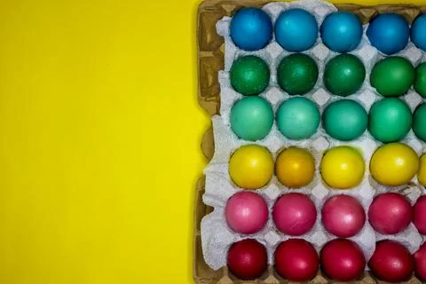 Colorful handmade painted Easter eggs on the yellow background Foto stock