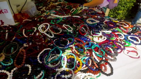 Colorful Handmade Stone Bracelets Displayed At Outdoor Street Market Stock Footage 342085849