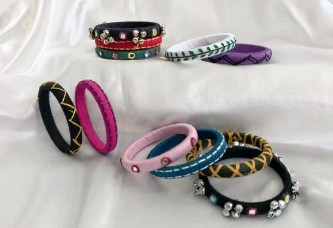 Colorful handmade thread bangles with mirror and bead embellishments Stock Photos