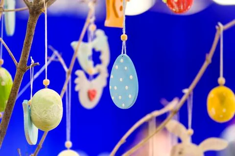 Colorful handmade wooden Easter elements: eggs, rabbits, chick. Easter bright Stock Photos