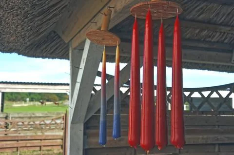 Colorful Hanging Candles in Rustic Setting Stock Photos