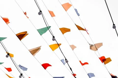 Colorful Hanging Flag on on a string on a white background Stock Photos