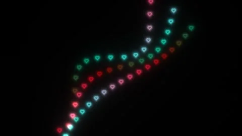 Colorful heart lights create a pattern on a dark background Stock Footage 338180808