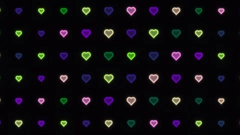 Colorful heart pattern with glowing lights on a dark Stock Footage 338235491