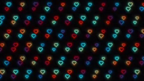 Colorful heart patterns create a vibrant display on a dark Stock Footage 338316932