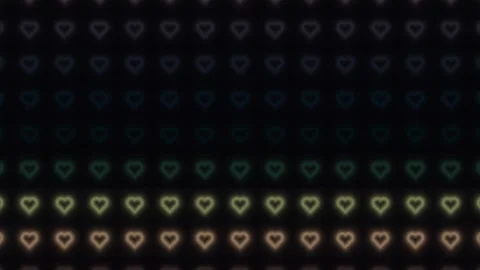 Colorful heart patterns on a dark background create visual Stock Footage 338225778