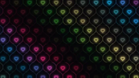 Colorful heart patterns fill a dark background in bright Stock Footage 338277245