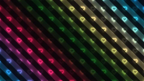 Colorful heart patterns flowing across a dark background Stock Footage 338182505