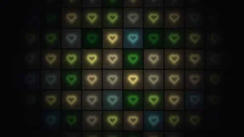 Colorful heart patterns glowing on a dark background Stock Footage 338200276