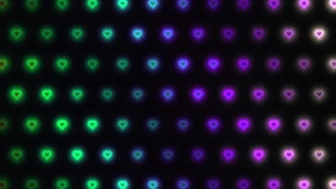 Colorful heart patterns with glowing lights on a dark Stock Footage 338318261