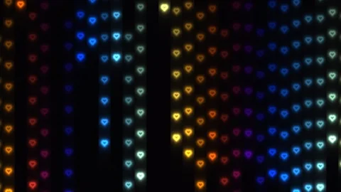Colorful heart patterns in vertical lines on a dark Stock Footage 338300244
