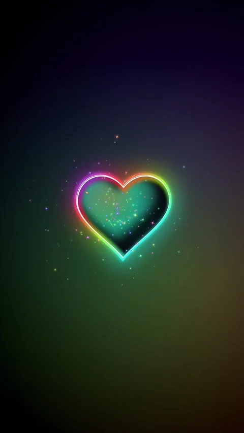 Colorful heart shape glowing on a black background with sparkles Stock Footage 344053962