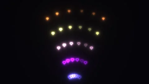 Colorful heart shapes in a circular pattern on a dark Stock Footage 338316501