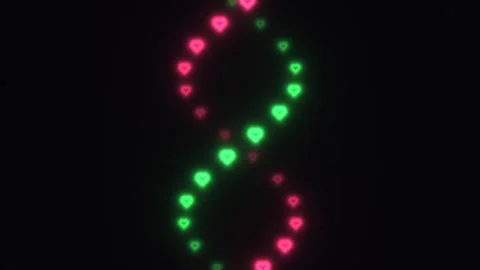 Colorful heart shapes create a moving pattern on a dark Stock Footage 338223711