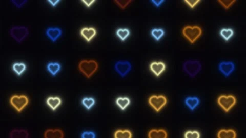 Colorful hearts create a bright pattern on a dark Stock Footage 338281222