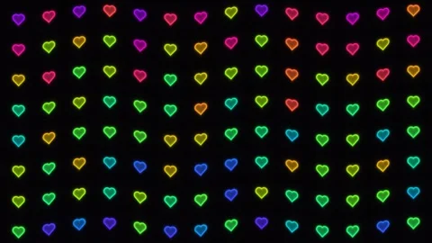 Colorful hearts create a pattern on a dark background Stock Footage 338129357