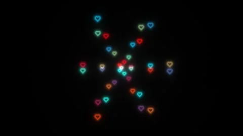 Colorful hearts on dark background create a lively pattern Stock Footage 338227226
