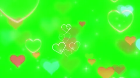Colorful hearts float on green background with sparkles Stock Footage 338216159
