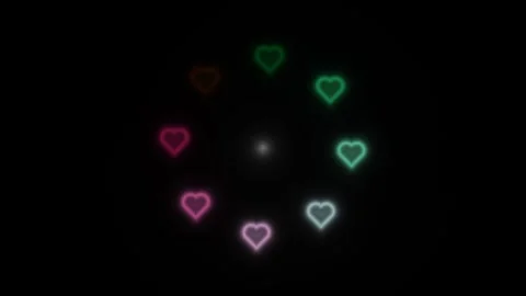 Colorful hearts glowing in a circular pattern on dark Stock Footage 338276864