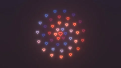 Colorful hearts glowing in a circular pattern on a dark Stock Footage 339324553