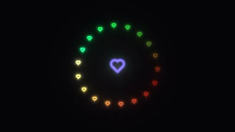 Colorful hearts move in a circular pattern against a dark Stock Footage 338393365