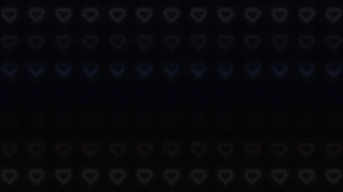Colorful hearts move on a dark background in a lively Stock Footage 338232943
