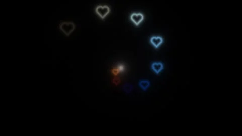 Colorful hearts moving in a circular pattern on a dark Stock Footage 339004580