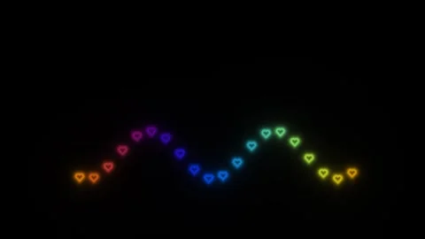 Colorful hearts shine in a wave pattern against a dark Stock Footage 338226629