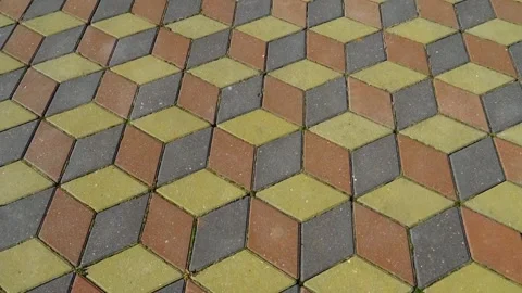 Colorful hexagon pattern on a sidewalk during daytime in an urban setting Stock Footage 335240810